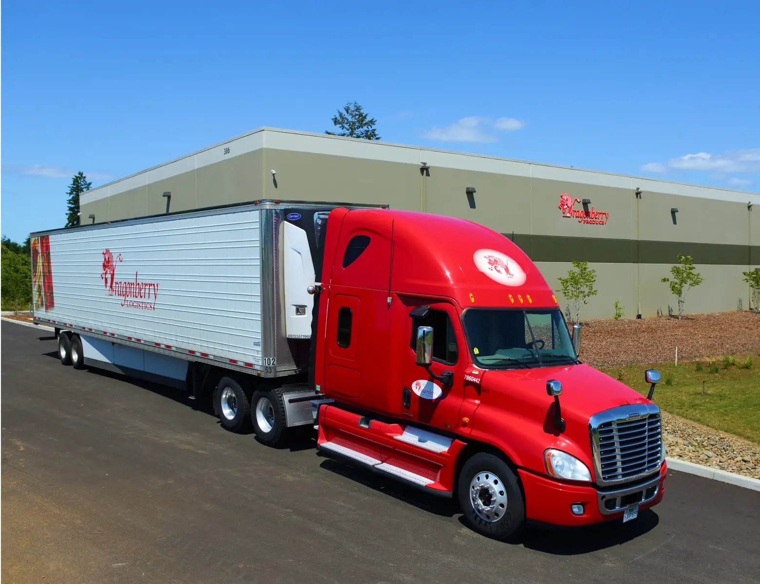 Red semi-truck parks outside a building. "Raspberry Logistics" and "Raspberry Produce" are visible on the truck and building, respectively.